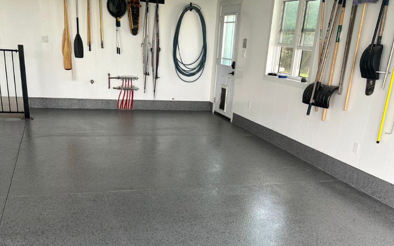 Garage floor coated in polyaspartic flooring by Pryce Designs